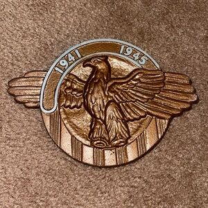 Vintage World War II brass eagle patriotic plaque